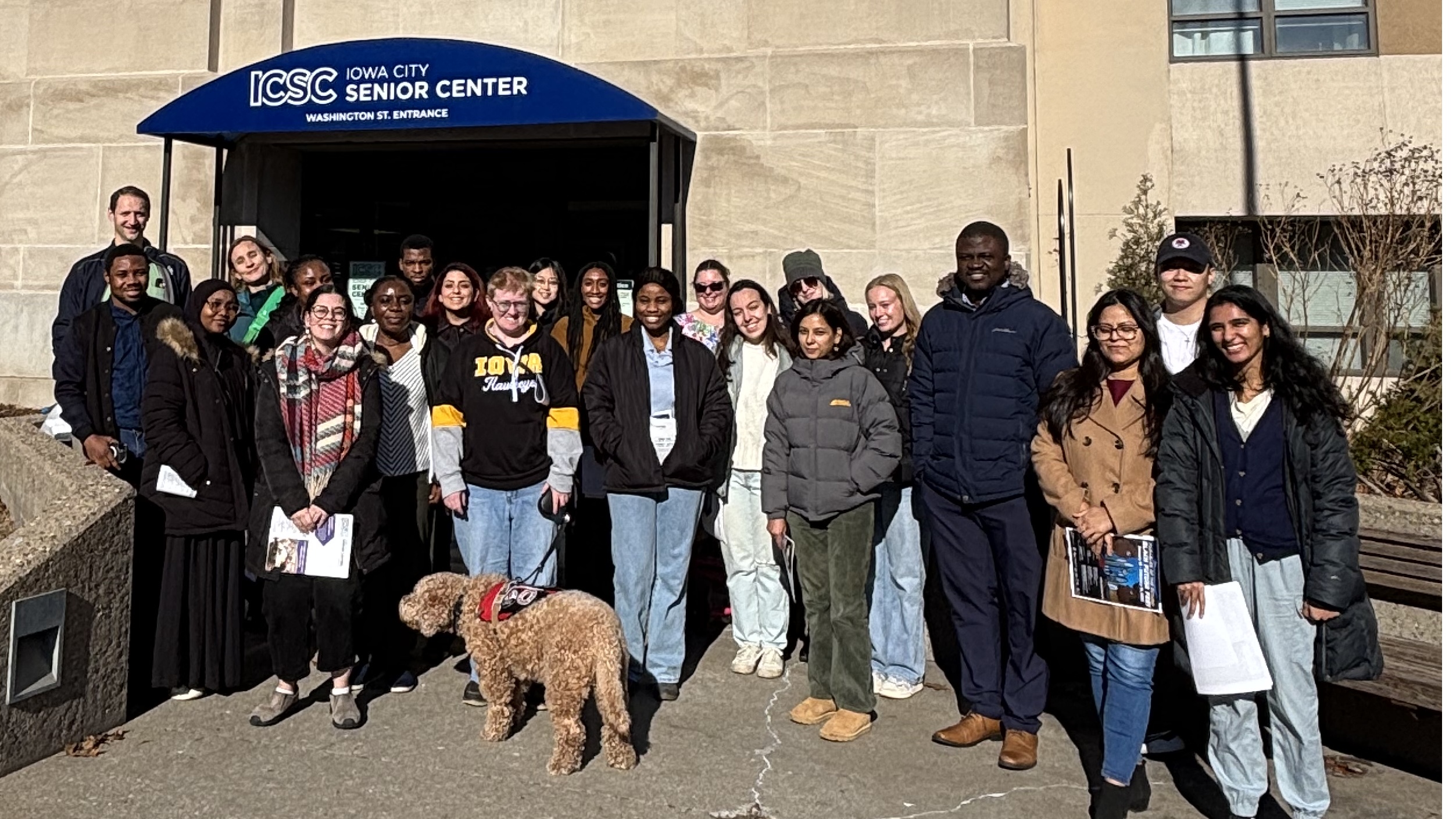 Group of graduate students in front of the Iowa Senior Center