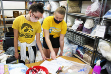 Students help sort household items at a local nonprofit