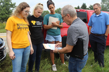 Dave Heiar works with a group of students