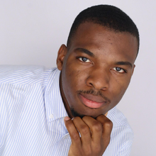 Black man in front of white background