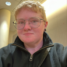 White person with cropped blond hair