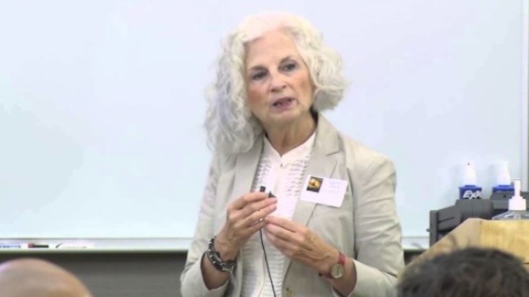 Carolyn Colvin speaks to a classroom